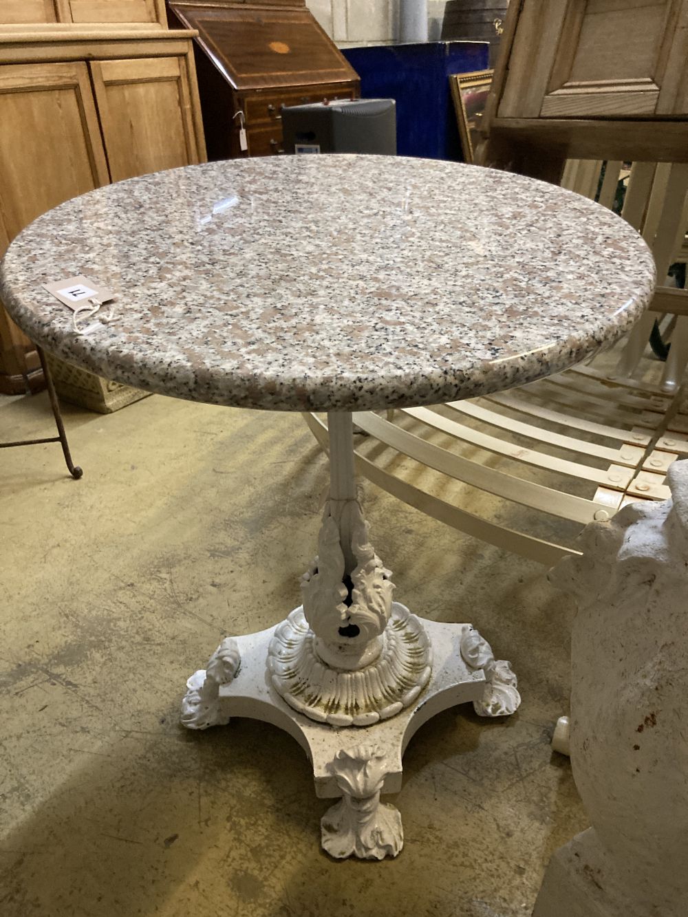 A Victorian cast iron circular marble topped garden table, diameter 60cm height 76cm